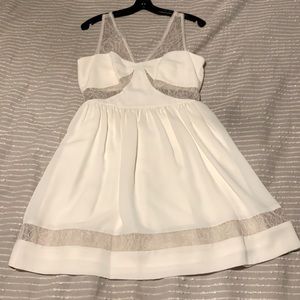 Ivory dress with sheer lace cut outs on bodice